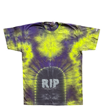 Load image into Gallery viewer, Halloween Tombstone RIP design tie dye shirt. The overall colour of the shirt is green &amp; purple with a grave design at the bottom centre with RIP added in creepy silver writing.