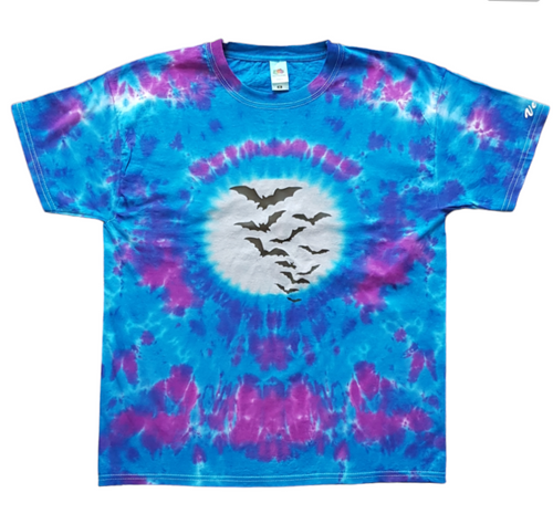Tie dye Halloween shirt with colours of pink and purple and a silver moon with black Bats flying across the Moon. Front View