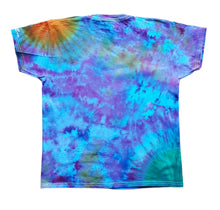 Load image into Gallery viewer, The back view of the shirt with blue and purple hues and the orange planet at top left and green plant at bottom right