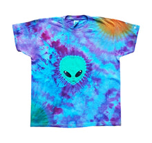 Load image into Gallery viewer, Halloween Alien face and planets tie dye shirt. Alien face is green and in the centre of the shirt with a green planet at bottom left of the shirt and an orange planet at top right of the shirt. The remaining colour of the shirt is a mix of purple and blue hues.