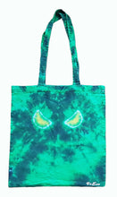 Load image into Gallery viewer, Halloween Evil Eyes design tie dye tote bag. Overall colour of the bag is Green with Yellow Evil Eyes