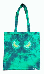 Halloween Evil Eyes design tie dye tote bag. Overall colour of the bag is Green with Yellow Evil Eyes