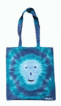 Load image into Gallery viewer, Halloween Skull design tie dye tote bag. Overall colour of the bag is Blue and Green in a circle pattern with a grey skull with black eyes, nose and mouth