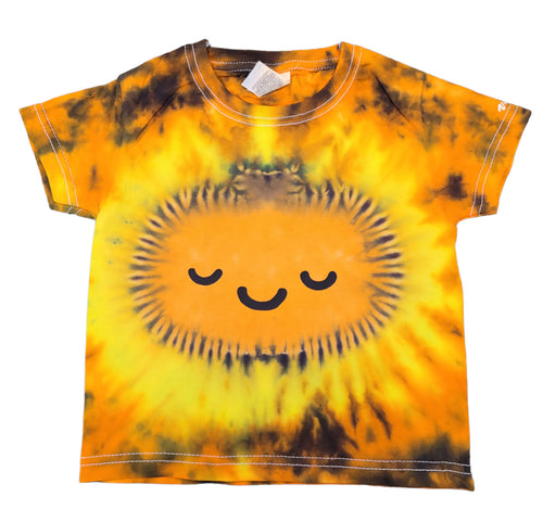 Halloween smiling Pumpkin face design tie dye short sleeve shirt. The overall colour of the shirt is orange & black with the pumpkin in the centre of the shirt. The eyes and mouth detail are added in black vinyl. This is the front view of the shirt
