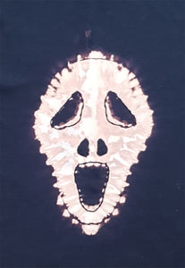 Screaming Skull reverse tie dye design on a black short sleeve tshirt. Closeup of the screaming skull design