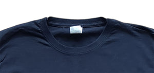 Screaming Skull reverse tie dye design on a black short sleeve tshirt.  Closeup of the crew neck collar double stitch hem