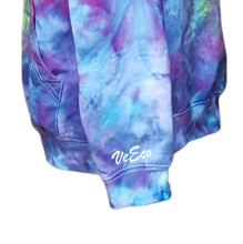 Load image into Gallery viewer, Ice tie dyed Northern Lights inspired hoodie. Overall blue and purple colour scheme with a lime green band diagonal from bottom left to right shoulder. Close up of the left sleeve with brand name VeEco in white vinyl