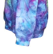 Load image into Gallery viewer, Ice tie dyed Northern Lights inspired hoodie. Overall blue and purple colour scheme with a lime green band diagonal from bottom left to right shoulder. Close up of the right sleeve